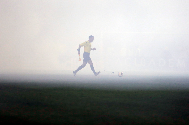 Illustration for article titled Smoke, Flares, Riot Police In Belgrade Derby Make For Haunting Photos